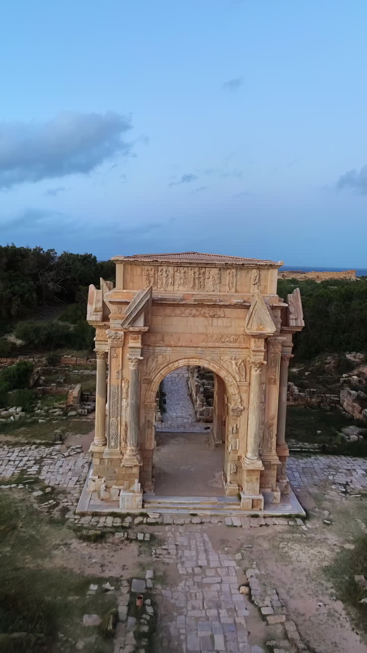 Aerial drone view of the magnificent Arch of Septimius Severus in Leptis Magna, Libya. Vertical