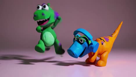orange clay dinosaur dancing joyfully while wearing blue headphones, accompanied by a green clay dinosaur with purple spots crawling playfully on the floor, creating a whimsical scene