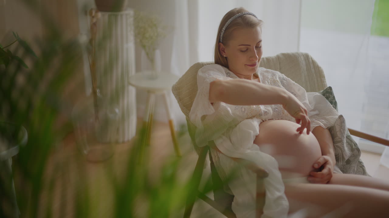 Pregnant Woman with Child Joyfully Embraces Baby Bump