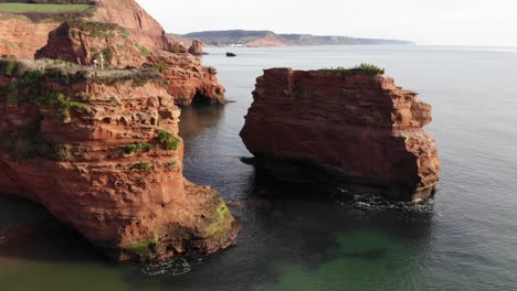 Aerial-Flying-Towards-Sandstone-Sea-Stacks-At-Ladram-Bay