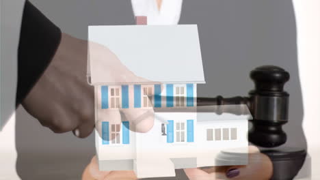 digital animation of female real estate agent holding house model 4k