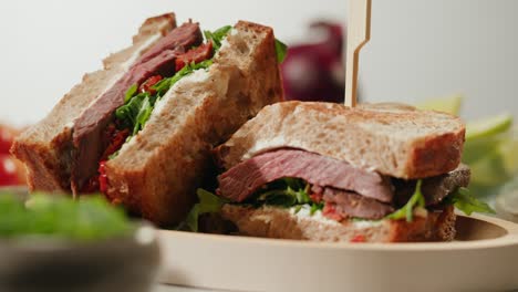 beef steak sandwich with sun-dried tomatoes and cream cheese