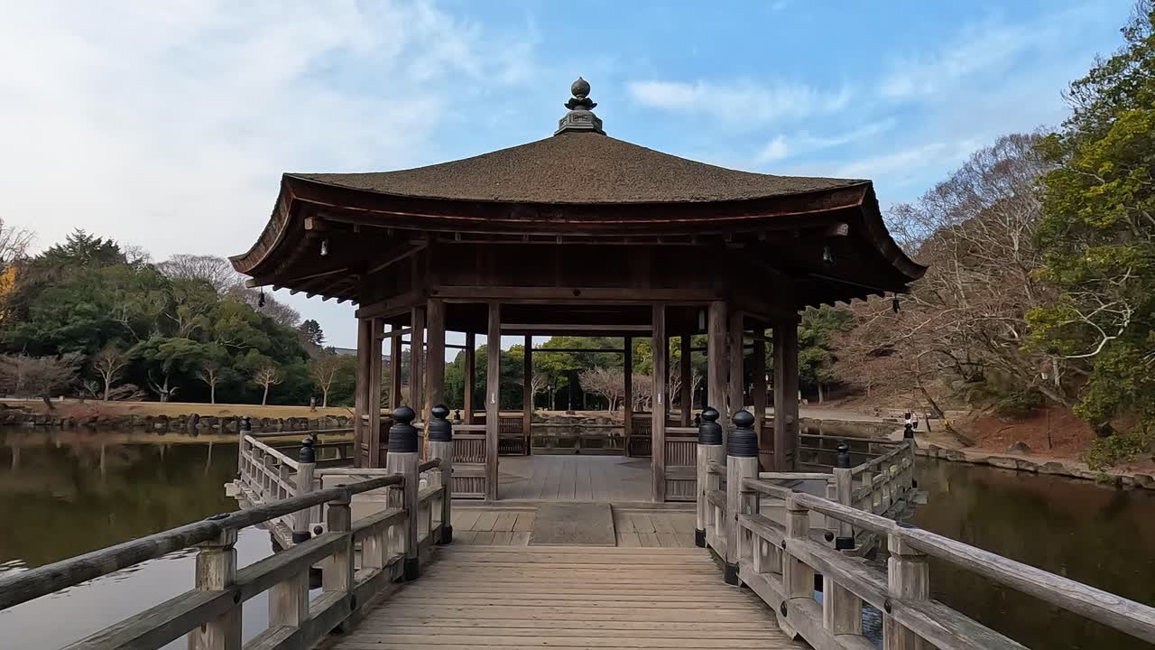 Autumn in Nara view on the Ukimodo Pavillion on Takabatakecho pond in Japan