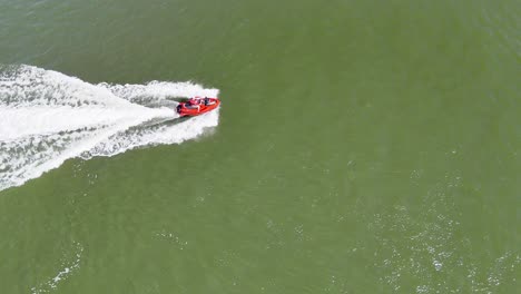 jet ski speeds across open water