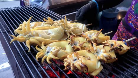 fresh grilled squid on a coal stove seafood grilled thai street food