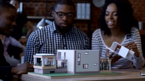 ethnic colleagues creating futuristic accommodation
