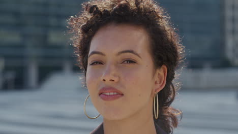 portrait beautiful mixed race woman smiling in city urban scene