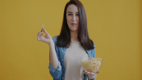 woman eating potato chips