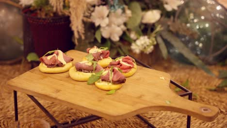 ham appetizers on a wooden table