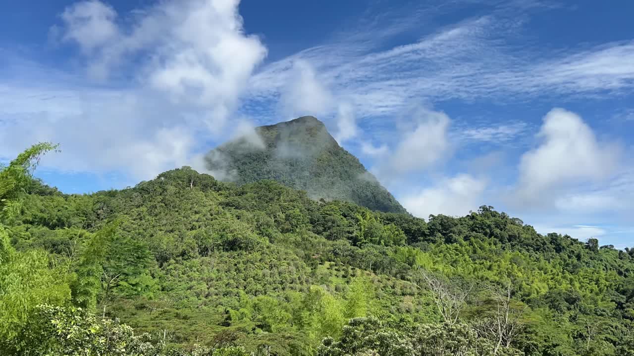 Time Lapse of Cerro Tusa, the pyramid-shaped mountain near Venecia in the Antioquia region of Colombia, rising from the lush highlands of the Western Andes