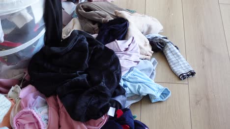 a messy pile of clothes on the floor