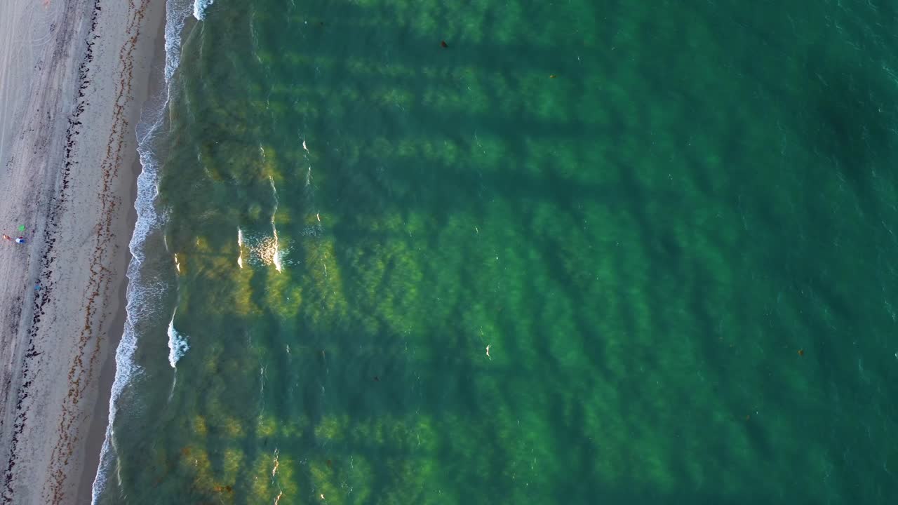 Amazing drone video of sunset rays shinning through aquamarine waters in Delray Beach Florida