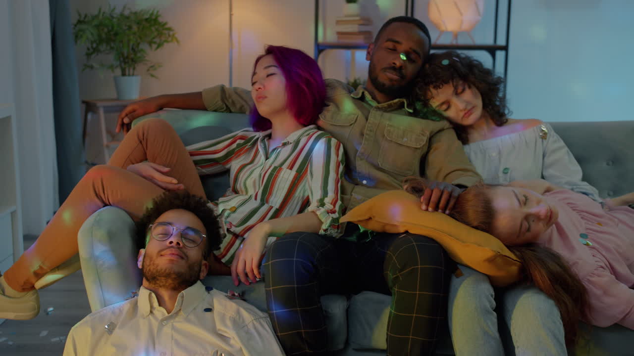 Friends Sleeping on a Couch After a Party