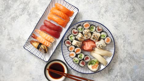 Asian-food-assortment--Various-sushi-rolls-placed-on-ceramic-plates