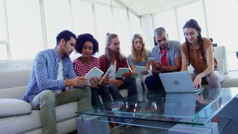 executives using digital tablet and laptop 4k