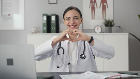 Happy-Indian-female-doctor-showing-heart-sign