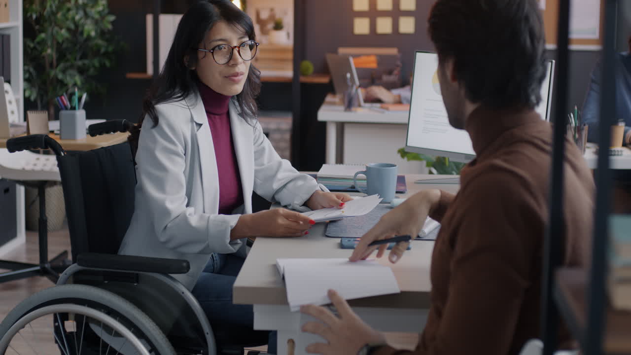 Business Meeting with Disabled Employee