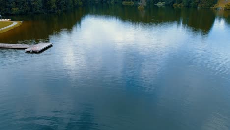 aerial-lake-view-has-a-small-pier-and-forest