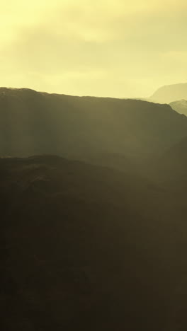 misty mountain range at sunset