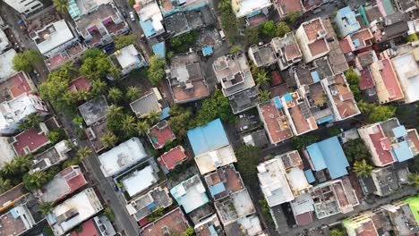drone captures the pulse of maduravoyal with buildings, roads, and railway lines.