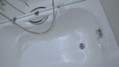 beautiful slow motion overhead shot of the jacuzzi inside a luxury hotel white room bathroom in spain. 4k
