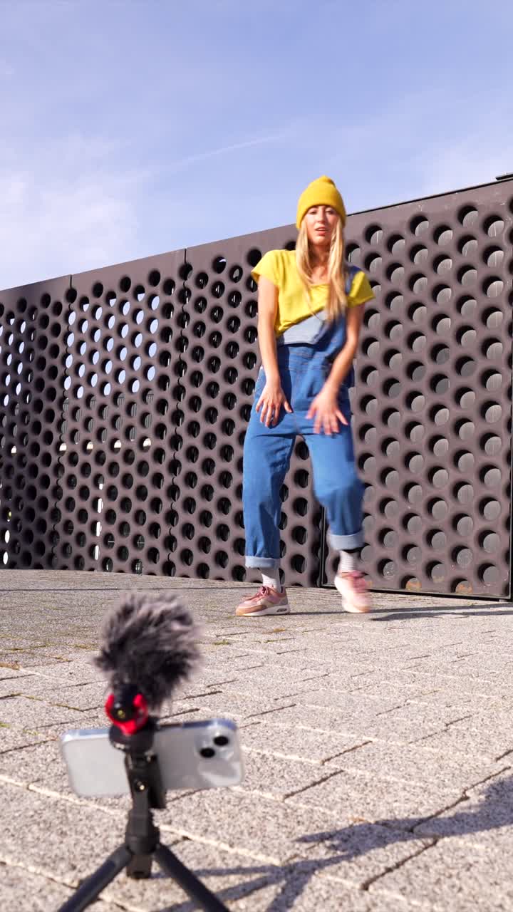 Woman recording social media vlog on smartphone