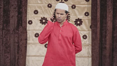 muslim man talking on mobile phone