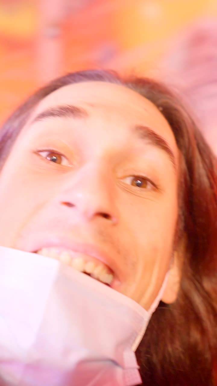 Close-up of a person with a mask making an exaggerated expression