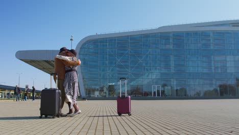 elderly old husband and wife retirees tourists reunion meeting in airport terminal after traveling