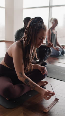 group meditation session with incense