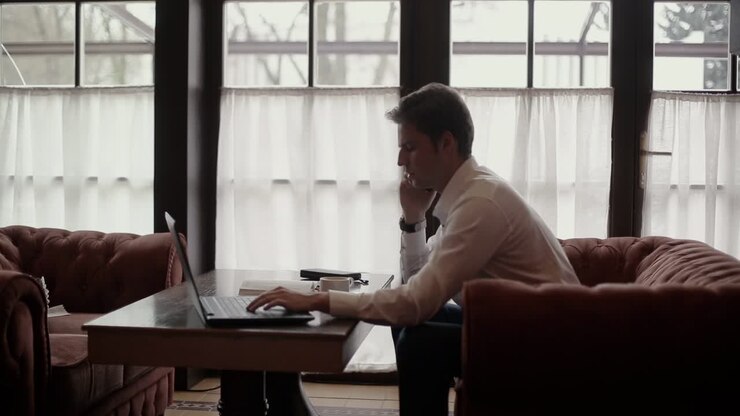 Man Working in a Cafe