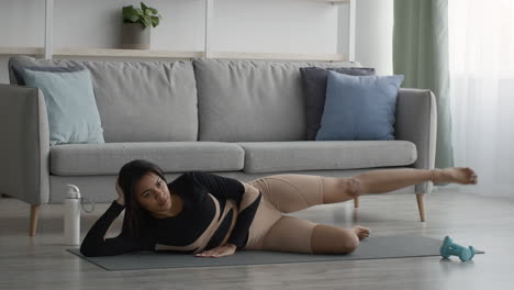 Woman doing leg raises at home