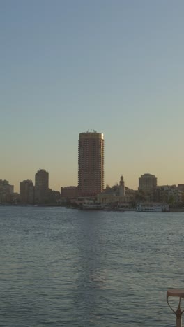 a view of a building overlooking on nile, close up shot, trucking shot