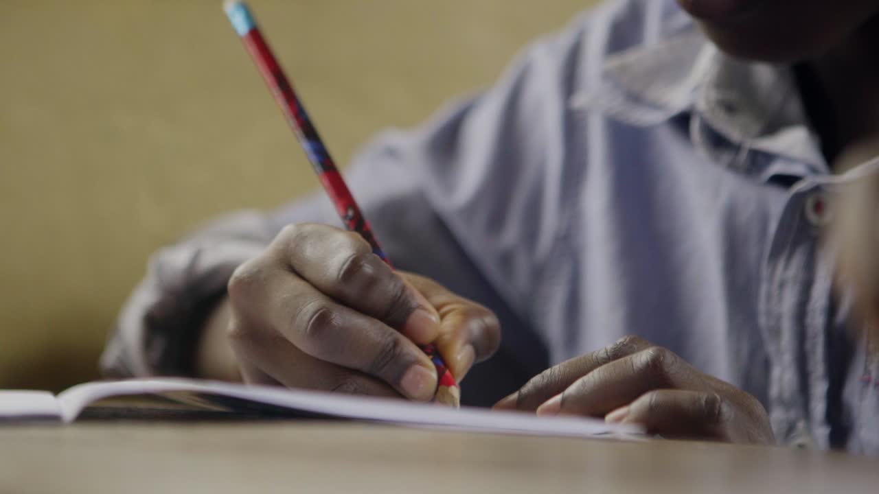 Child Writing on Notepad 02