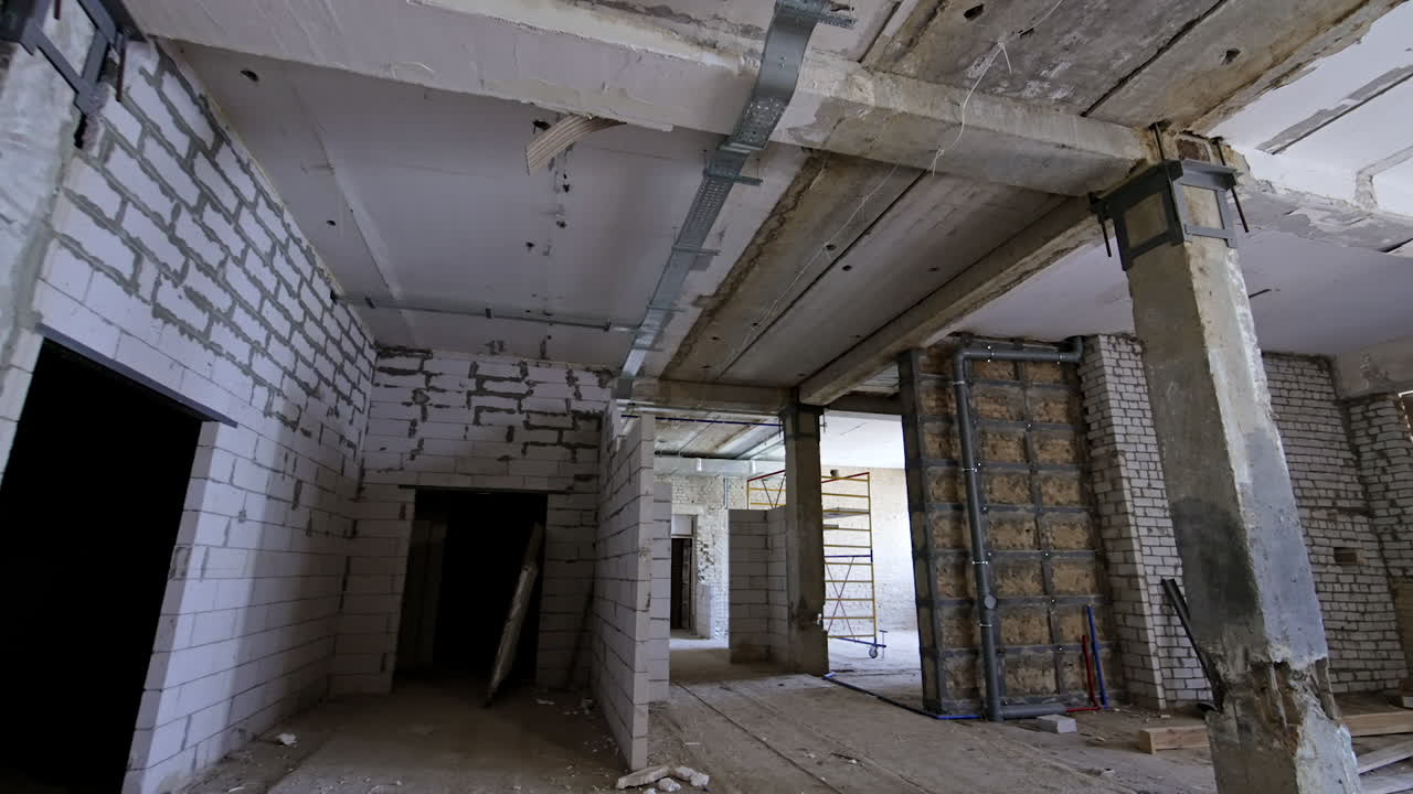 Interior of the old building with the newly-built brick walls. Reconstructing long-standing premise.