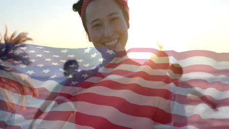 Animation-of-flag-of-usa-over-happy-diverse-friends-on-beach-in-summer