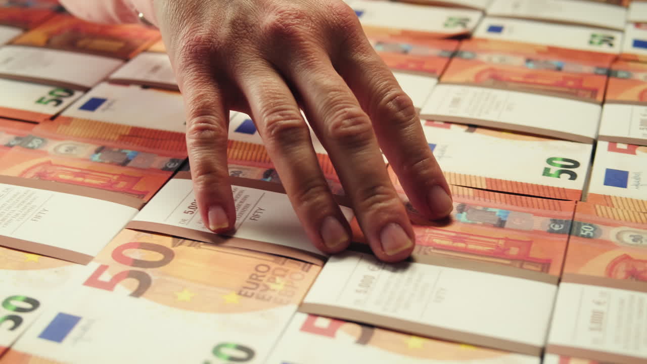 Stacks of cash dollars and euro, Banknotes counting, Specialised police officer Counting dollar euro banknotes in crime lab with machine, cashed out money, bitcoin changing, buying home flat in bank.