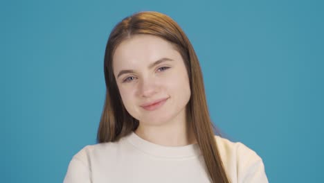 Smiling-young-woman-looking-at-camera-fun-and-happy.