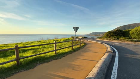curved road near north atlantic ocean that leads to camino de santiago