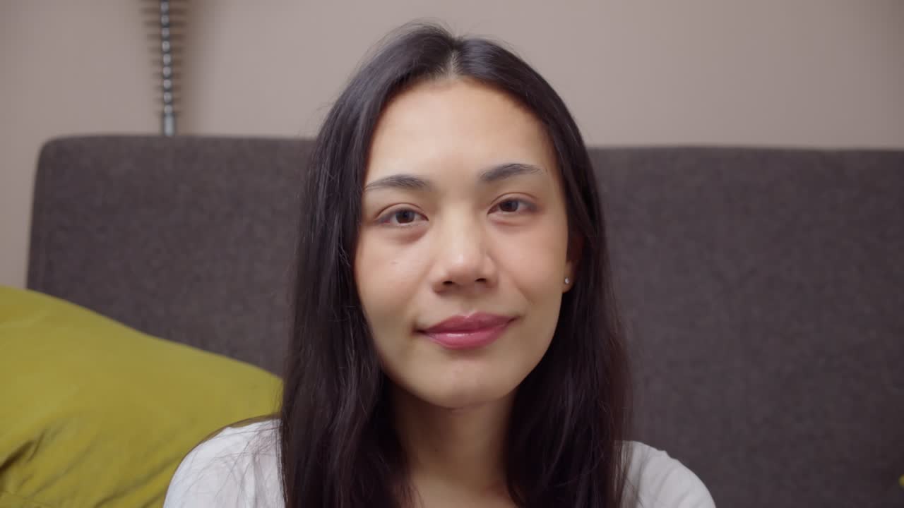 Portrait young Asian business woman are video conference at home office.Female looking at camera doing online job interview,vlog or teaching by video telephony app.Working at home.