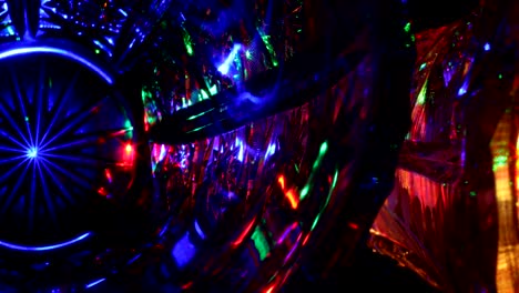 abstract shining light with chandelier crystal in dark night. luxury star light in dark for nackground concept, lights thrue crystal reflections and refractions dark colorful background