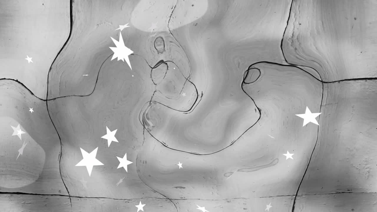 Animation of swirling patterns with white stars over textured gray background