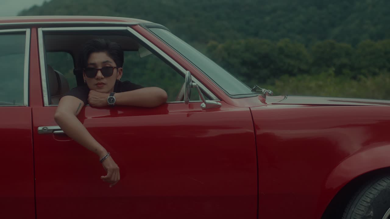 Woman in a vintage red car