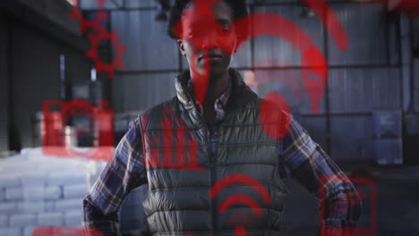 in warehouse, confident person interacting with red digital animation on scene