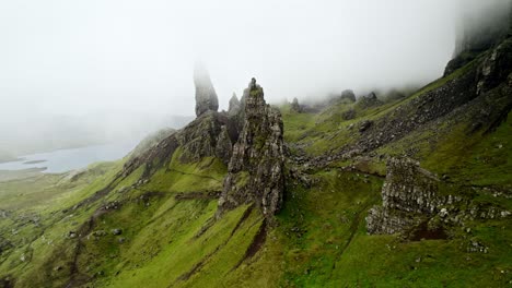 shot fades white into dense fog at old man of storr, isle of skye scotland