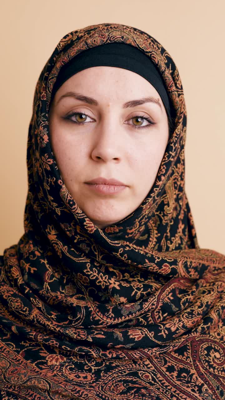 Close Up Portrait of a Young Muslim Woman Wearing a Patterned Hijab