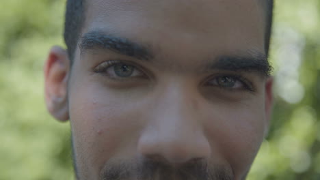 closeup of confident mans eyes looking at camera, being serious