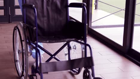 Nurse-staff-bringing-wheelchair-