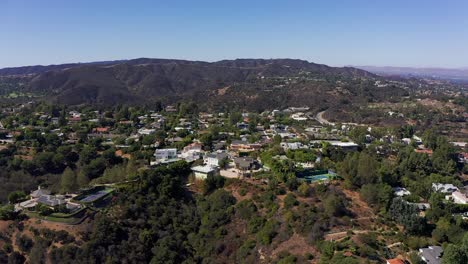 Wide-aerial-descending-shot-of-a-neighborhood-in-the-hills-above-Sherman-Oaks