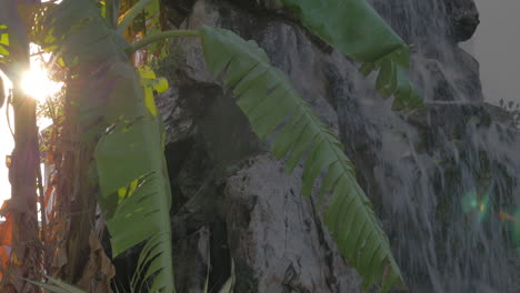 Rocky-waterfall-in-the-garden-at-sunset